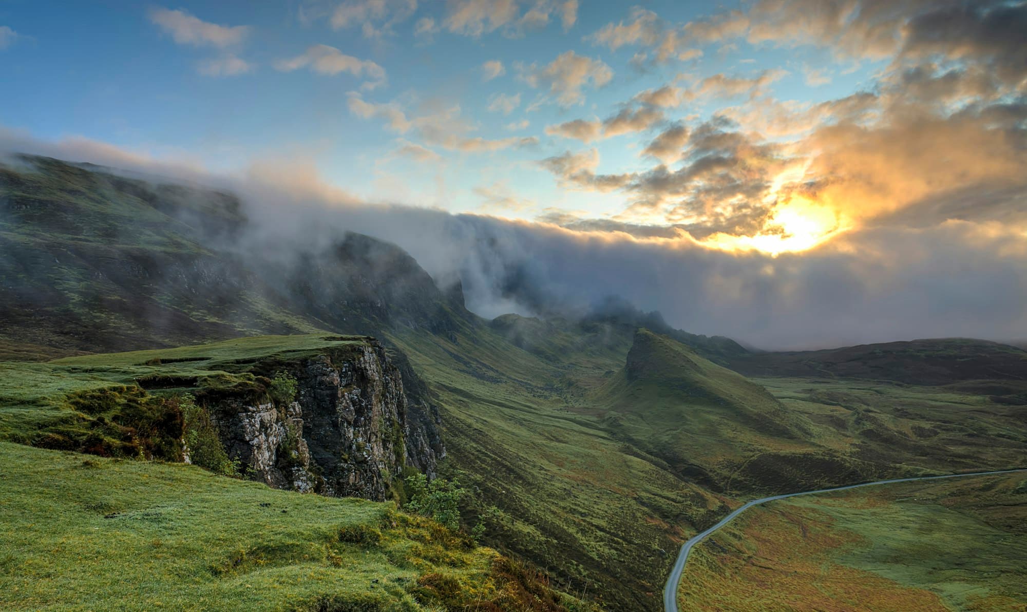 Misty forested mountains at dawn